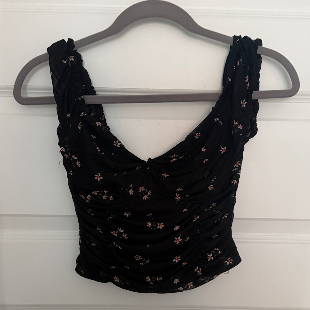 short-sleeve black blouse w/ daisies